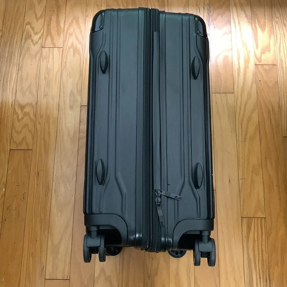 Traveler’s Choice Black Hard-case 24” Suitcase